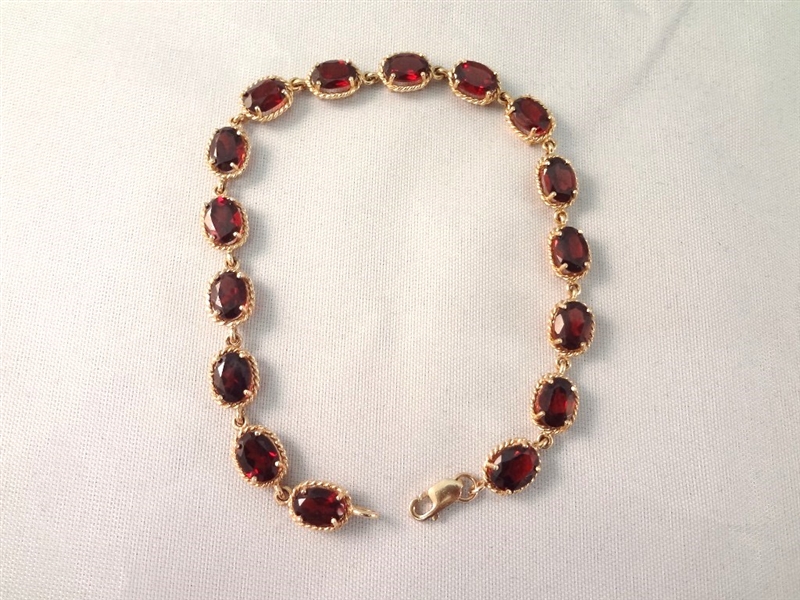 14K Gold Tennis Bracelet (16) Oval Garnets 7x5mm (8) carats