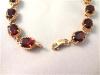 14K Gold Tennis Bracelet (16) Oval Garnets 7x5mm (8) carats