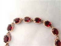 14K Gold Tennis Bracelet (16) Oval Garnets 7x5mm (8) carats