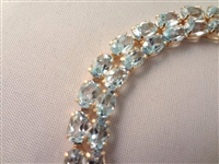 14K Gold Tennis Bracelet (52) Cushion Topaz Oval 6x4mm (26) carats:
