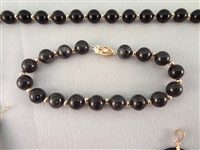 14K Gold Black Jade Jewelry Suite: (1) Necklace, (4) Pendants, (2) Bracelets, (1) Ring