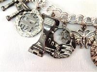 Monet Sterling Silver Charm Bracelet (14) Charms