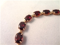14K Gold Tennis Bracelet (18) Oval Cut Garnets 7.5 Long