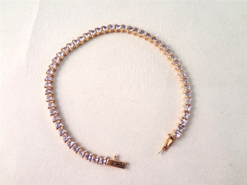 14K Gold Tennis Bracelet with (52) Triangle Cut Purple Stones 7.25" Long