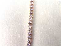 14K Gold Tennis Bracelet with (52) Triangle Cut Purple Stones 7.25 Long