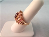 14K Gold Ring (1) Center Oval Amethyst 7x4mm, (20) Round Amethyst 1.7mm Ring Size 6.75