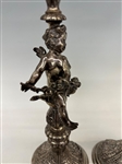 Pair Baroque Silver High Repousse Putti Candle Sticks