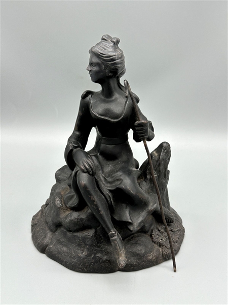 Cast Iron Figurine of Woman With Shepherds Hook on Rock
