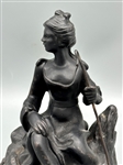 Cast Iron Figurine of Woman With Shepherds Hook on Rock