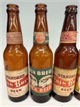 (4) Standard Erin Brew Beer Bottles