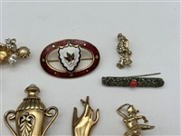 (12) Group of Costume Brooches; Hattie Carnegie, Others