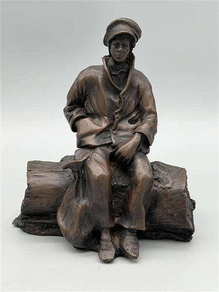 De La Poer Figurine Bronze Man Seated on a Log