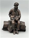 De La Poer Figurine Bronze Man Seated on a Log