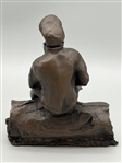 De La Poer Figurine Bronze Man Seated on a Log